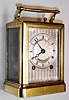 Paul Garnier, Paris, France a small Series I carriage clock in brass corniche case with 8 day, time and half hour bell strike, spring driven movement with original chaff cutter platform escapement and engine turned silver dial, c1840 s#506 branded onto topside of bottom board, including leather travel case