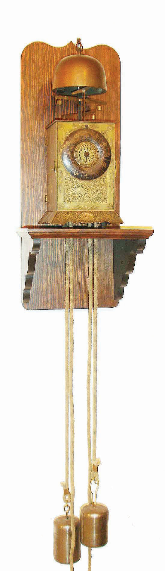 Japanese, double foliot lantern clock, large, "Nicho Tenpu Yagura-dokei", 30 hour, steel framed movement with tooled brass covers, now on a purpose made wall bracket and with later weights — Antique Clocks Price Guide