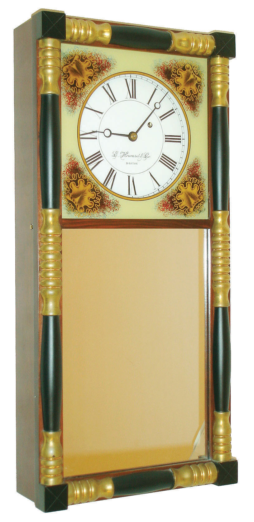 E. Howard & Co., Boston, Mass., reproduction NH mirror wall clock, 8 days, time only, weight driven movement signed in a mahogany case with typical NH turned half columns gilded and ebonized and reverse painted top glass and lower mirror tablets, painted metal dial, dated 1990 — Antique Clocks Price Guide