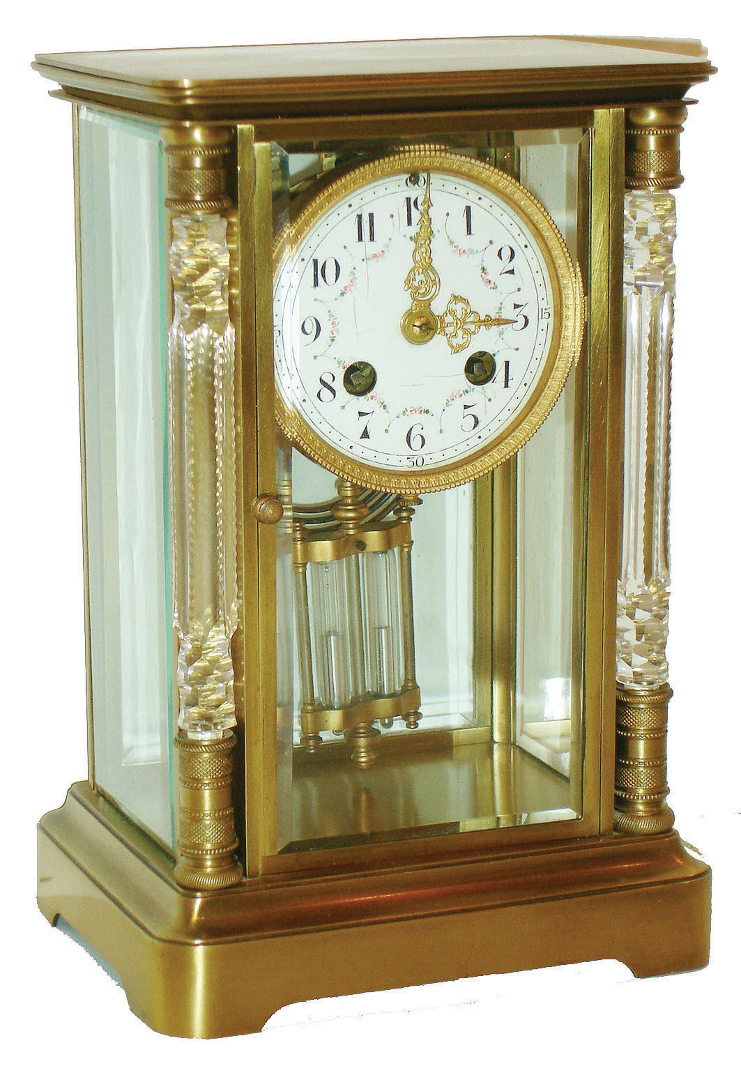 France, unusual crystal regulator, brass case with beveled glasses, the front door flanked by cut glass columns with engine turned capitals and bases, gilt bead and leaf ornamented bezel with Arabic numeral white enamel dial decorated with floral garlands, gilt Louis XV hands, 8 day time and strike pendule a Paris movement with Brocot escapement and coil gong, movement signed F. Pelissier France, and also with the mark of G. Megnin, gilt pendulum with 2 mercury vials, with key, c1900 — Antique Clocks Price Guide