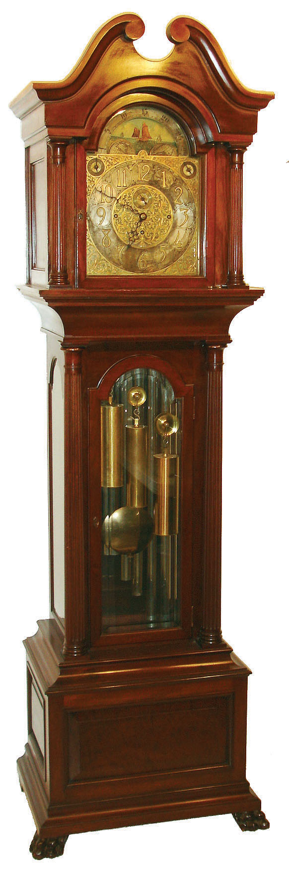 J.J. Elliot, London, England, tall clock, 8 days, time, strike and chime on nine tubes playing three tunes, Westminster, Whittington and St. Michael, three weight driven movement in a mahogany case with paw feet, fully turned reeded columns flanking trunk and hood door, beveled glasses on trunk and broken arch top with silvered chapter ring and moon phase in arch, brass numerals and heavy cutout fancy brass spandrels on corners and center and strike / silent and tune selector, c1900 — Antique Clocks Price Guide