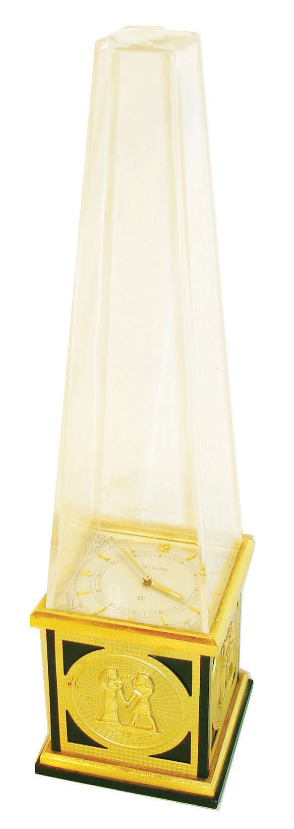 Le Coultre & Co., Switzerland, ref. 462 "Obelisk" desk clock, black base with applied Egyptian style gilt ornament, with transparent Lucite obelisk above, silvered dial with applied Arabic numeral and baton markers, gilt baton hands with luminous compound, 8 day time only movement, c1970 — Antique Clocks Price Guide