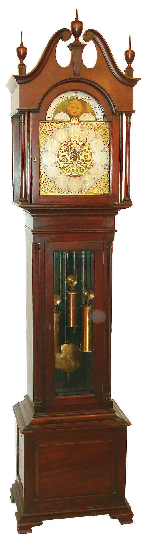 Herschede Clock Co., Cincinnati, Ohio, Colonial style 5 tube hall clock, stamped with maker's details on backboard, 8 days, time, strike and chime, three weight driven German movement playing Westminster tune in a mahogany case with reeded quarter columns on sides, bracket feet and beveled glass trunk. The silvered dial has applied brass Arabic numerals, brass corner and center spandrels and moon phase, c1920 — Antique Clocks Price Guide