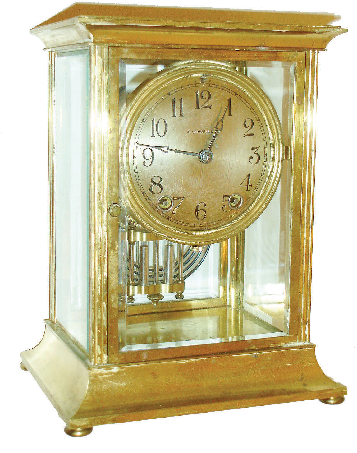 Seth Thomas Clock Co., Thomaston, Conn., for A. Stowell & Co., crystal regulator, "Empire No. 303", Arabic numeral silvered dial, blued steel hands, round 8 day time and strike movement, with simulated mercury pendulum, c1920 — Antique Clocks Price Guide