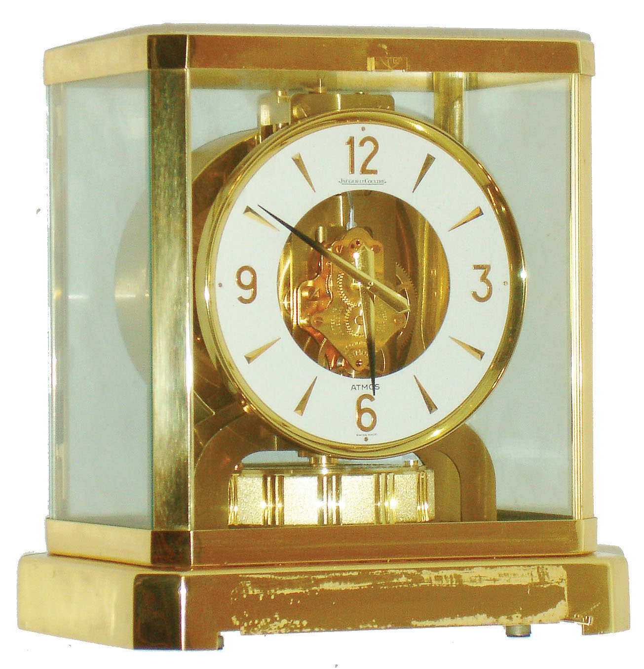 Jaeger - LeCoultre, Switzerland, Atmos clock, 15 jewel gilt caliber 528-8 movement, gilt torsion pendulum, round white painted dial with applied gilt Arabic numerals and arrow markers, gilt hands with back tips, contained in a glazed rectangular case with removable front panel, 9 1/4" h, serial #391415 — Antique Clocks Price Guide