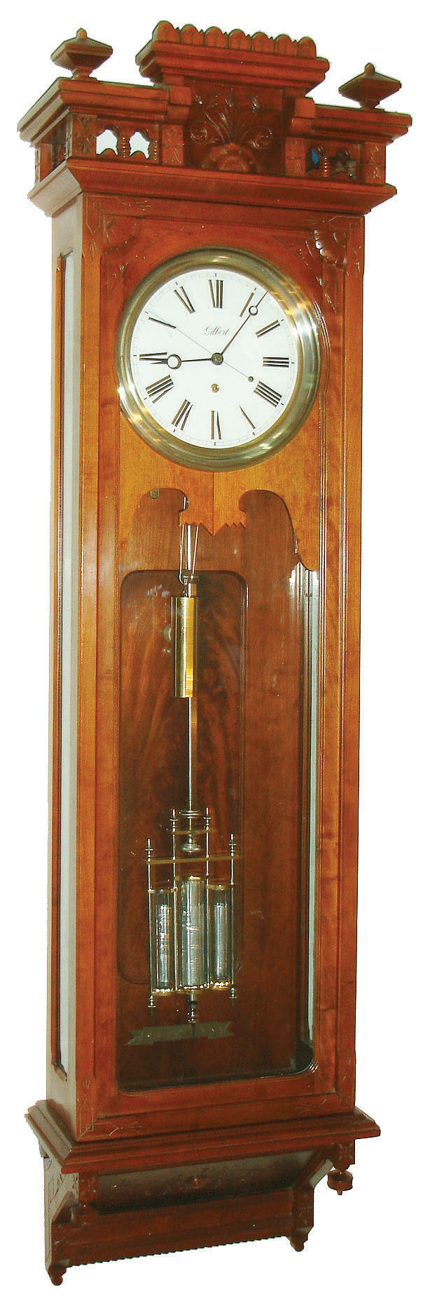 Wm. L. Gilbert Clock Co., Winsted, Conn., "Regulator No. 18" wall clock, 8 days, time only, weight driven American made movement with Graham deadbeat escapement and three jar mercury pendulum in a cherry case with white enamel dial and sweep seconds hand, c1901 — Antique Clocks Price Guide