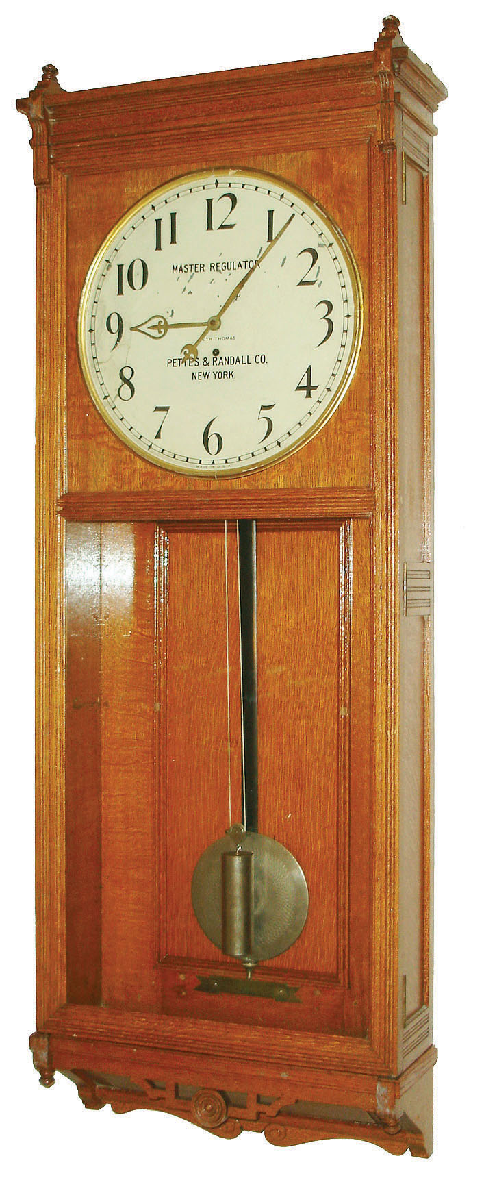 Seth Thomas Clock Co., Thomaston, Conn., "Master Clock M" wall clock, 8 days, time only, weight driven movement in an oak case with 18" painted metal dial signed "MASTER REGULATOR, PETTES & RANDALL CO. NEW YORK", c1922 — Antique Clocks Price Guide