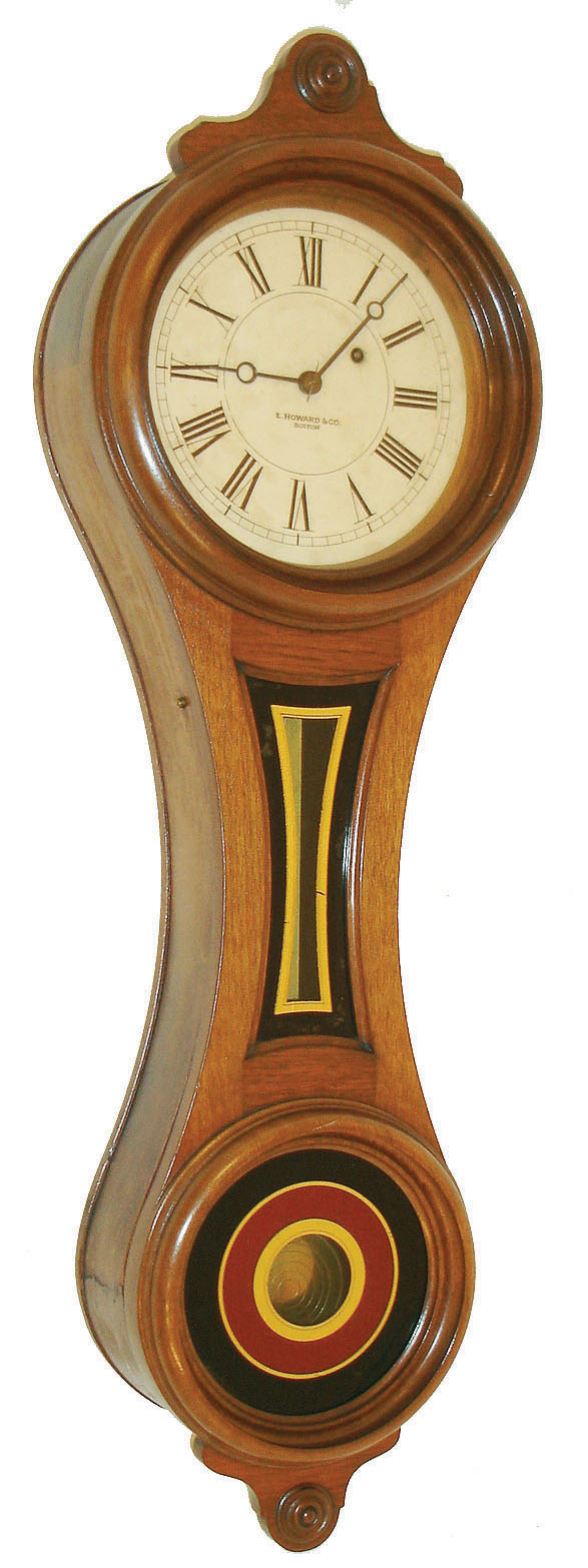 E. Howard & Co., Boston, Mass., "No. 10 Regulator" figure eight wall clock, 8 days, time only, weight driven movement in a walnut case with painted iron dial and reverse painted tablets, c1890 — Antique Clocks Price Guide