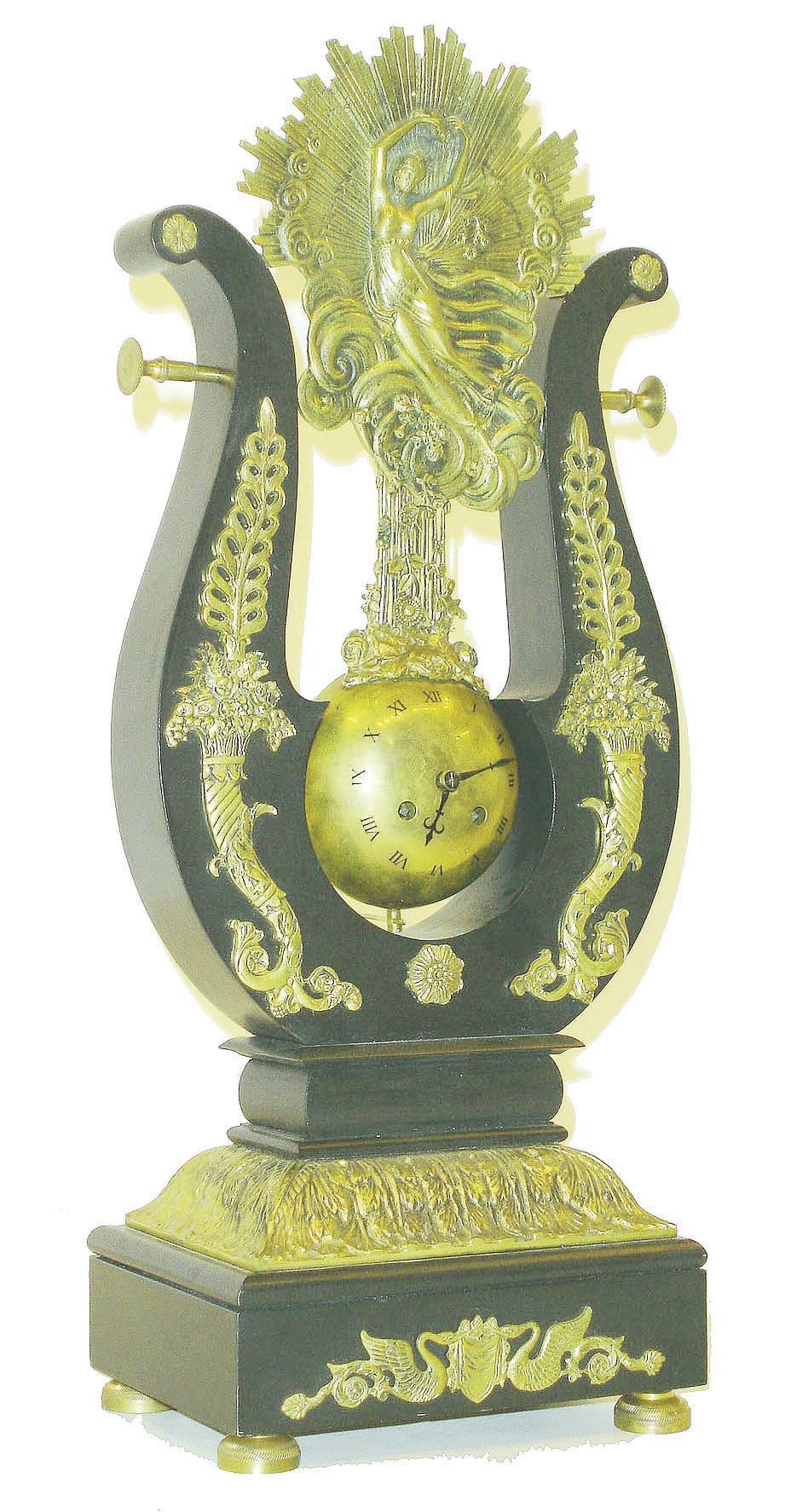 French, suspended pendule, the movement contained within the suspended globe, surrounded by an ebonized mantle case, the entire clock a reproduction. — Antique Clocks Price Guide