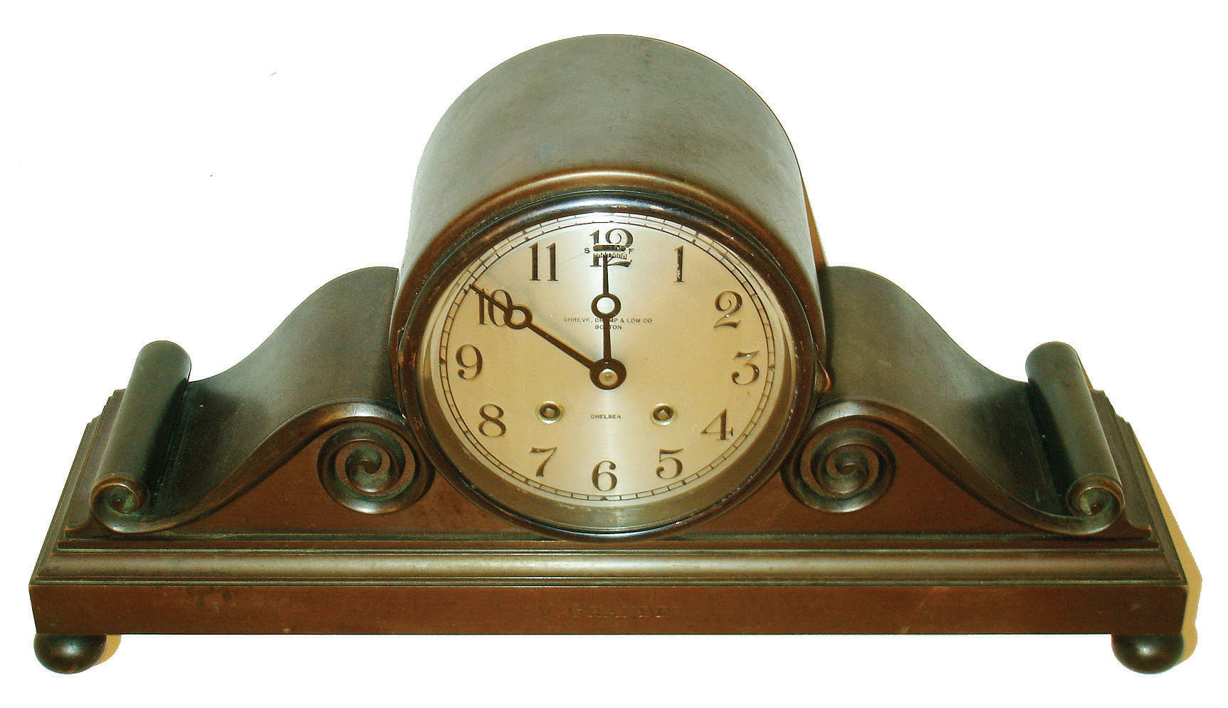 Chelsea Clock CO., Chelsea, Mass., for Shreve, Crump & Low, Boston, "Tambour No. 3", with 5" dial, patinated cast bronze case on ball feet, front of base engraved "V. Grande", bezel with convex, beveled glass, Arabic numeral, silvered dial withy black painted steel moon hands, 8 day time and strike movement sounding the hours and half hour on a gong, serial #180173, c1925 — Antique Clocks Price Guide