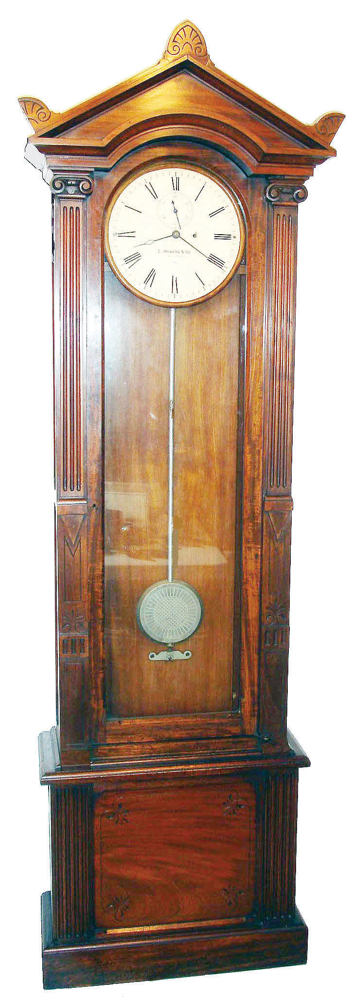 E. Howard & Co., Boston, a custom regulator, probably a wall clock originally, now with a purpose made, matching base of mahogany, 8-day weight driven and with fancy decorated pendulum bob. — Antique Clocks Price Guide