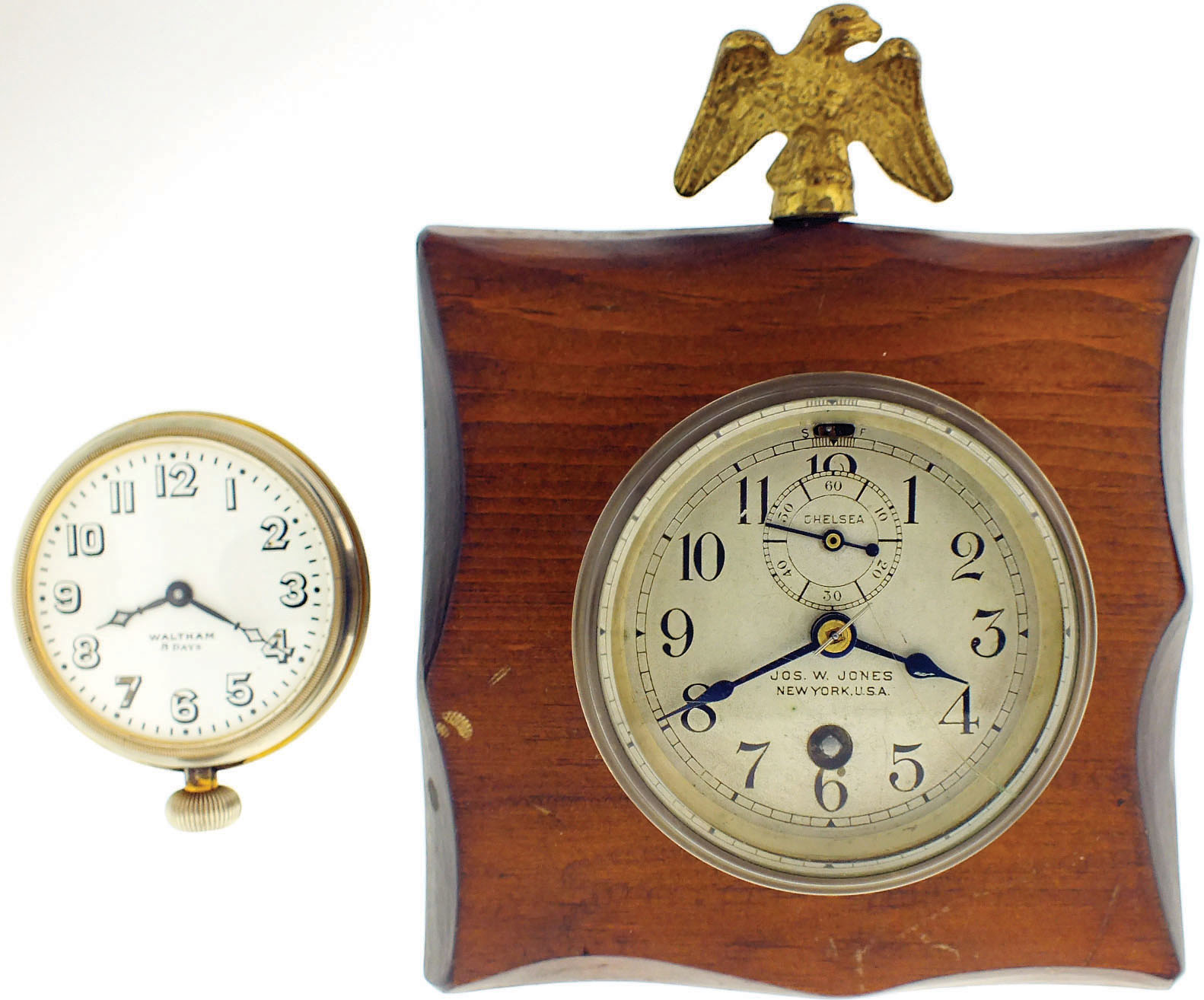 Clocks- 2 (Two): a Chelsea timepiece with 2 3/4" dial, signed "Jos. W. Jones, New York, U.S.A.", and mounted to a wooden plaque with eagle finial, and a Waltham 8 day travel clock with enamel dial, serial #22871188 — Antique Clocks Price Guide