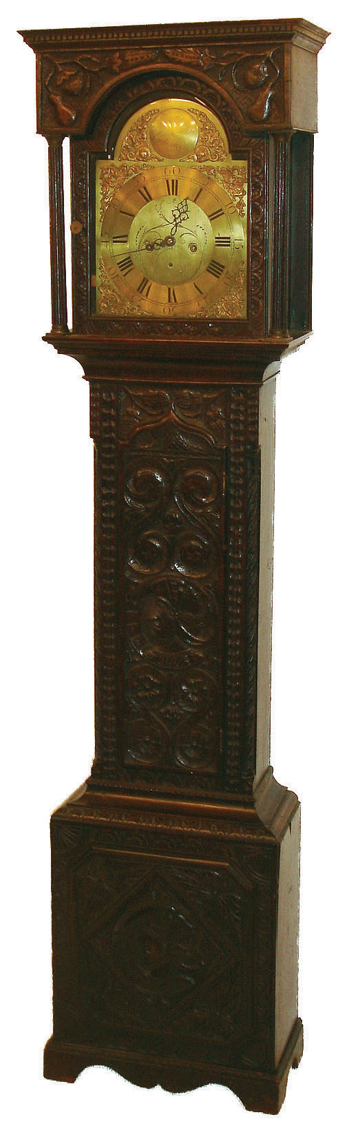 Joseph Atkinson, Gateshead, England, tall clock, 8 days, time, calendar and bell strike, weight driven movement in a heavily carved oak case with flat top hood, brass dial, case late 18th century, movement mid 18th century — Antique Clocks Price Guide