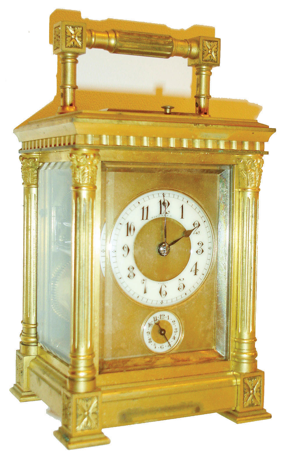 Henri Jacot, France, for Tiffany & Co., Paris, carriage clock, gilt brass Anglaise Riche variant case with beveled glasses, the rear glass with nicely engraved cipher, gilt dial mask with Arabic numeral white enamel time and alarm dials, blued steel hands, 8 day brass movement striking on gongs, grand sonnerie in passing, and repeating at will, with lever escapement platform, the back plate with HJ and parrot mark, #5942, c1890 — Antique Clocks Price Guide