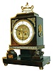 Austria, mantel clock with automata on dial, the ebonized case supported at the front corners by gilt turtles, front with stamped brass ornament, case sides with lion mask handles, top with alabaster urn mounted with snake form handles, beaded brass trim , and brass finial, Arabic numeral, white enamel dial with an automated figure representing Cupid forging arrows, the figure striking his anvil as the clock sounds, blued steel hands, two day time and strike movement, fancy brass pendulum with silk suspension, c1830