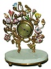 French, Lady's boudoir 30 hour alarm clock, with Louis XVI style porcelain flowers in vines around the movement, on white marble base, c1910