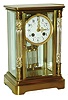 France, unusual crystal regulator, brass case with beveled glasses, the front door flanked by cut glass columns with engine turned capitals and bases, gilt bead and leaf ornamented bezel with Arabic numeral white enamel dial decorated with floral garlands, gilt Louis XV hands, 8 day time and strike pendule a Paris movement with Brocot escapement and coil gong, movement signed F. Pelissier France, and also with the mark of G. Megnin, gilt pendulum with 2 mercury vials, with key, c1900