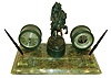 Chelsea Clock Co., Chelsea, Mass., a substantial bronze and green onyx writing stand, the stone base with molded edge, raised holders each containing a "Parker 51" fountain pen, and with blotter tray, Chelsea 4 1/2" timepiece and matching barometer in green finished brass cases, flanking a patinated, signed bronze sculpture of an Arab on horseback holding a long gun, by Theodor Ullmann, and cast at the Arthur Rubenstein foundry, Vienna, Austria, on a hammered plinth with bronze finish, c1920