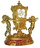 France, very decorative spelter desk clock featuring two winged putti carrying an ornate sedan chair with beveled glasses, the conveyance with rococo ornament and top with finial, above a floral and musical theme trophy with monogrammed tambourine, the casting signed Aug. Moreau, all on an oblong, molded multi color marble base, Roman numeral white enamel dial, gilt Louis XV hands, 8 day time and strike carriage clock movement with lever platform and striking on a bell, c1900