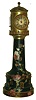 Burslem, England, Doulton lighthouse form clock case with French movement, the black Chine case with luster bands and chrysanthemum decoration, ogee molded brass cap with pierced brass railing, lighthouse top with ribbed dome and finial, mounted with barometer, thermometers, and 8 day timepiece movement with cylinder escapement, Roman numeral silvered dial with blued steel distaff style hands, barometer with blued steel hand and gilt set hand, base marked "Doulton Burslem" in green below a crown, impressed "Doultons" and "Doulton & Slaters patent", stamped "U.S. Patent 314002", and with overglaze initials in script "WBJ", c1890