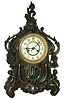 Waterbury Clock Co., Waterbury, Conn., "Valiant" shelf clock, 8 days, time and strike, spring driven movement in a cast metal case with Japanese Bronze finish and enamel dial, c1906