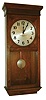 Self Winding Clock Co., New York, "No. 18-A" stained birch time only electrically wound wall clock, c1910