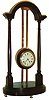 France, gravity clock, 8 day time only movement with lever platform escapement, balance with self starting device attached to winding pinion, Roman numeral, white enamel dial with Arabic red 15 minute markers, blued steel spade and poker hands, all contained in a weighted mahogany case, wound and driven by a brass rack and pinion, supported on a mahogany stand with turned columns and brass feet, c1900