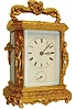 Japy Freres & Cie., France, carriage clock, the gilt Caryatid style case with beveled glasses, ornamented with leaves and trailing vines, figures in niches at the corners, and figural handle, Roman numeral white enamel dial with blued steel trefoil hands, Arabic alarm chapter with blued steel hand, signed 8 day brass time, strike and alarm movement, striking the hours in passing and repeating on demand, silvered lever platform, c1870