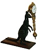 Junghans, Germany, "Kangaroo" 8 day time only novelty swing clock on oak platform, c1910