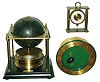 Clocks- 3 (Three) modern brass 8 day novelty and desk clocks: Gubelin floating turtle; 1979 annular globe clock from the Royal Geographical Society; Swiza Sheffield Swiss alarm clock; late 20th century