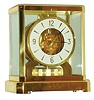 Jaeger - LeCoultre, Switzerland, Atmos clock, 15 jewel gilt caliber 528-1 movement, gilt torsion pendulum, round white painted dial with applied gilt Arabic numerals and arrow markers, gilt hands with back tips, contained in a glazed rectangular case with removable front panel, 9 1/4" h, serial #396761