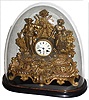 French gilt brass and spelter figural 8 day time and strike mantel clock on wood base with oval glass dome, c1880
