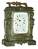 France, 8 day time and calendar carriage clock, spelter case in silver finish with caryatid corners, and decorated with classical style ornament, beveled glasses, Roman numeral white enamel dial with day of the week and date display, the calendar advancing at midnight, blued steel hands, key wind and set movement with lever platform, c1890