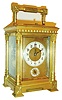 Henri Jacot, France, for Tiffany & Co., Paris, carriage clock, gilt brass Anglaise Riche variant case with beveled glasses, the rear glass with nicely engraved cipher, gilt dial mask with Arabic numeral white enamel time and alarm dials, blued steel hands, 8 day brass movement striking on gongs, grand sonnerie in passing, and repeating at will, with lever escapement platform, the back plate with HJ and parrot mark, #5942, c1890