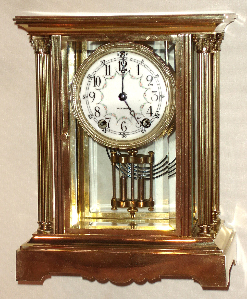 Seth Thomas Clock Co., Thomaston, Conn., "Empire No. 64" crystal regulator, 8 day, time and strike spring driven movement, polished brass and glass case, c1908 — Antique Clocks Price Guide