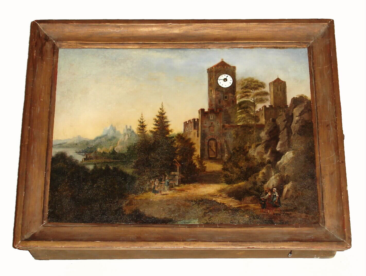 Picture clock with oil on zinc painting of castle scene inset with Continental rear wind, silk thread suspension movement in castle tower, spring driven with white enamel Roman numeral dial. The painting has a smooth molded frame, c1820 — Antique Clocks Price Guide