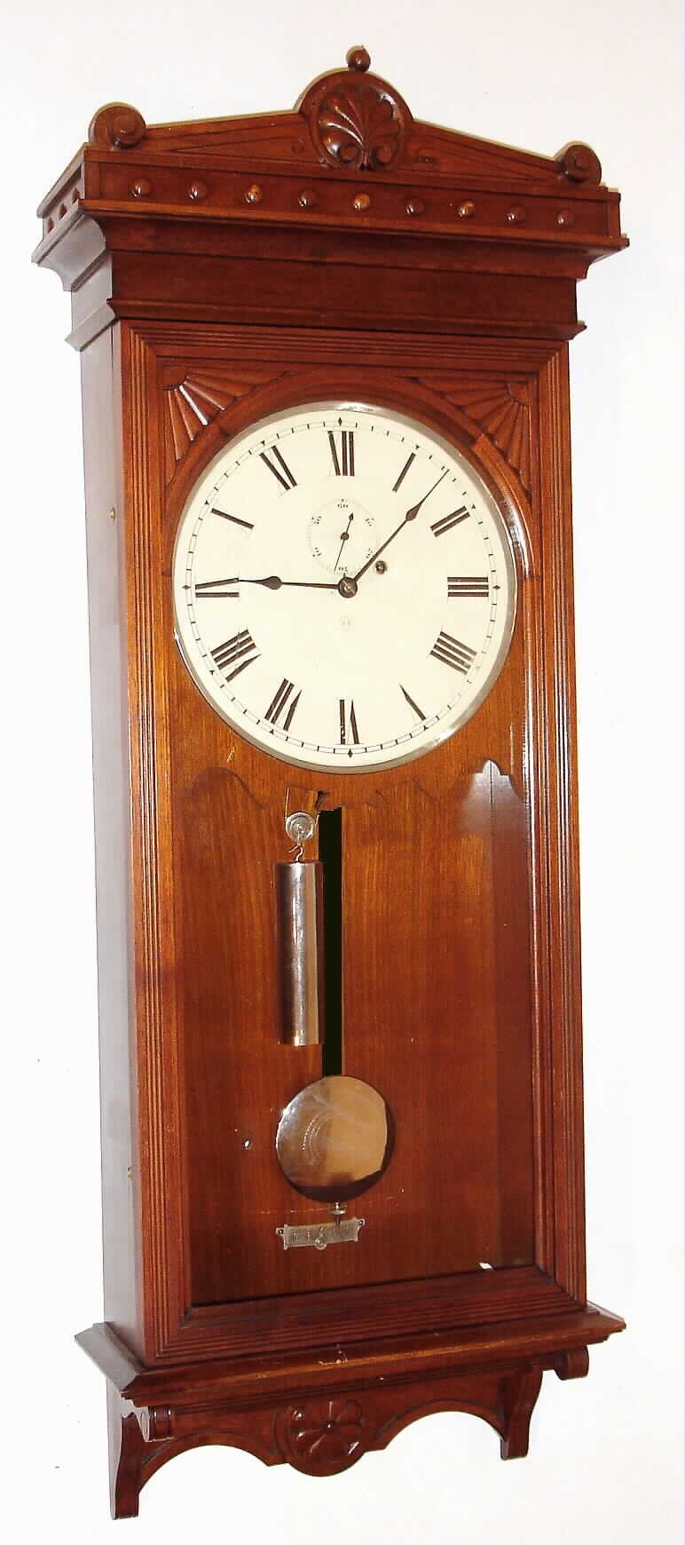Seth Thomas Clock Co., Thomaston, Conn. "Regulator No. 30" wall clock, 8 day, time only, weight driven movement in a walnut case with painted metal dial and nickel plated pendulum bob and weight, c1880 — Antique Clocks Price Guide