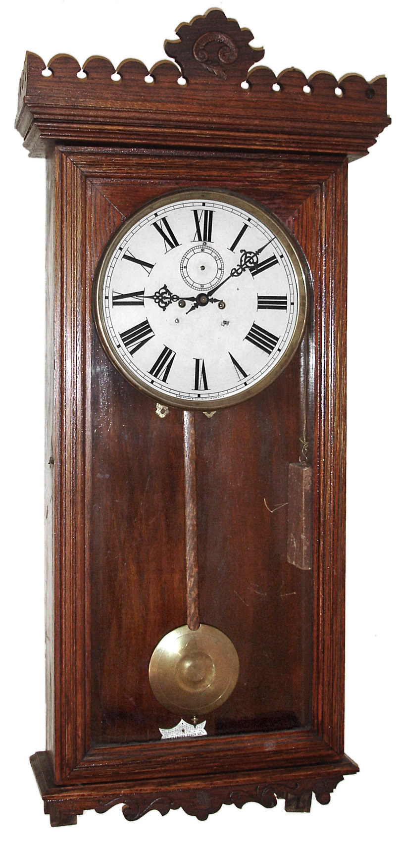 Waterbury Clock Co., Waterbury, Conn., "Regulator No. 18" wall clock, 8 day, time only, two weight driven movement in an oak case with painted metal dial, c1906 — Antique Clocks Price Guide