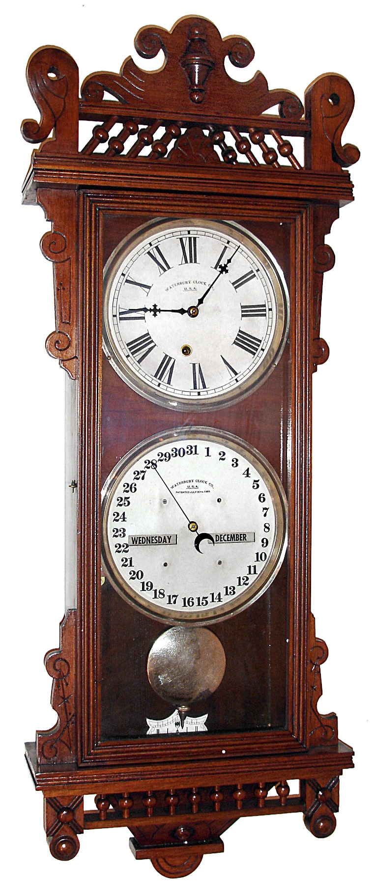 Waterbury Clock Co., Waterbury, Conn., "Calendar No. 32" wall clock, 8 day, time and perpetual calendar, spring driven movement in a walnut case with papered metal dials, c1885 — Antique Clocks Price Guide