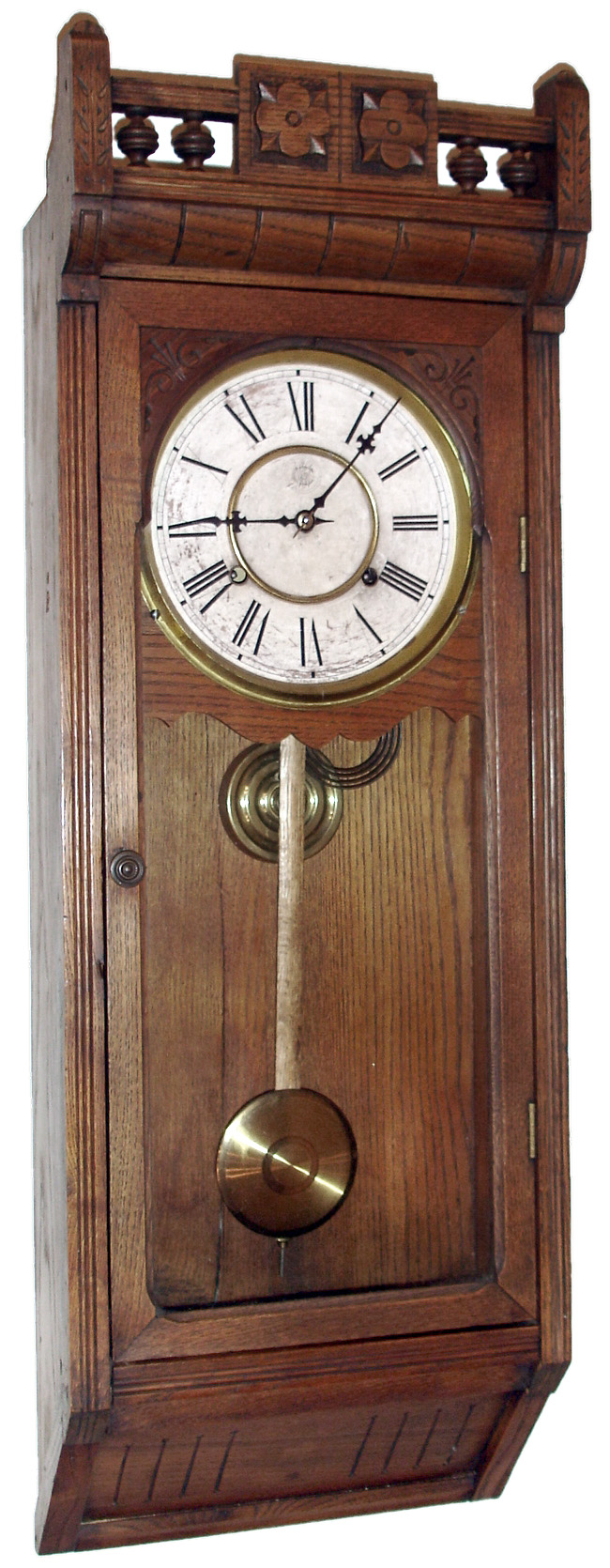 Waterbury Clock Co., Waterbury, Conn., "Stafford" wall clock, 8 day, time only, spring driven movement in an ash case with papered metal dial, c1890 — Antique Clocks Price Guide