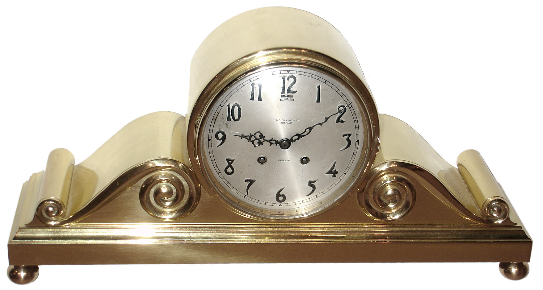 Chelsea Clock Co., Boston, Mass., retailed by T. and E. Dickinson Co., Buffalo "Tambour No. 3", 8 day, time and house strike, spring driven movement in a polished brass case with "Special" 6" silvered metal dial with raised applied numerals, c1915 s#103276 — Antique Clocks Price Guide