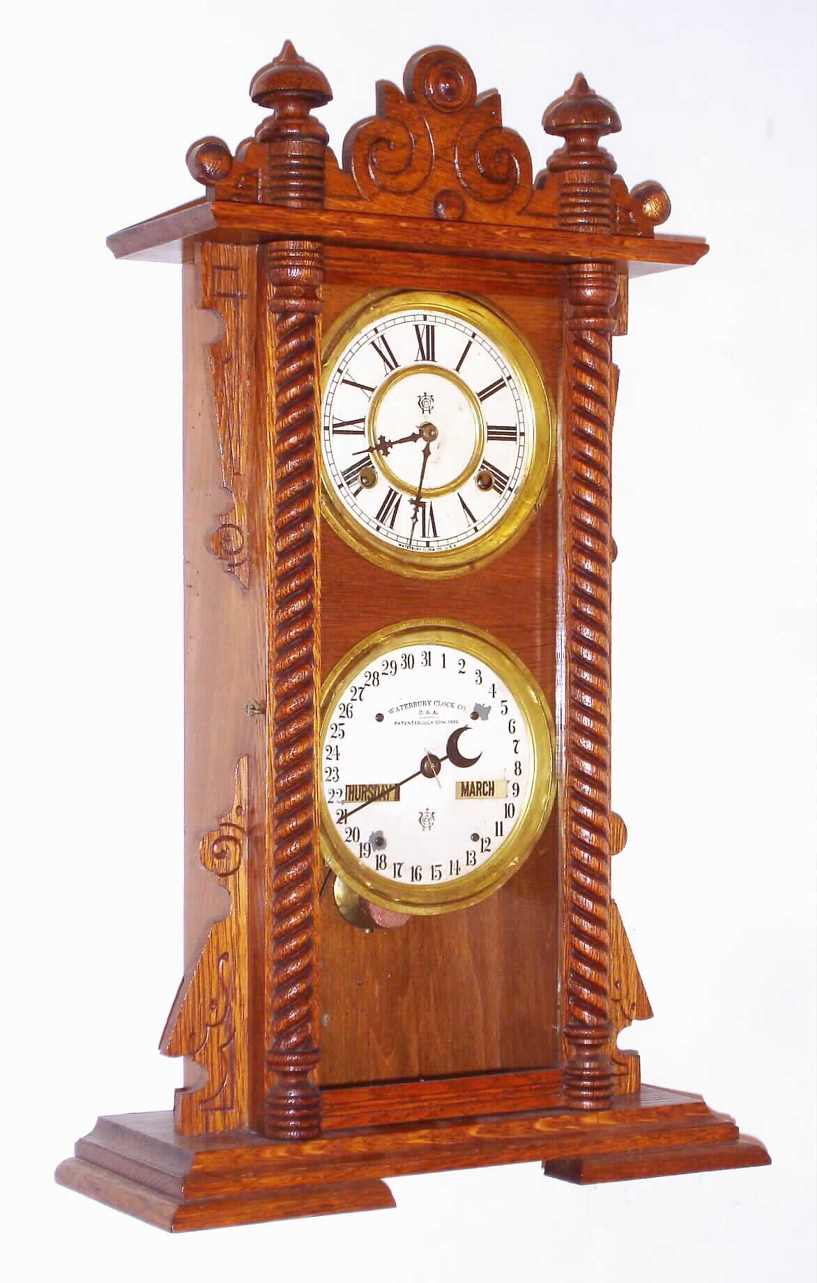 Waterbury Clock Co., Waterbury, Conn., "Calendar No. 40", 8 day, time and strike, double dial calendar clock, c1891. — Antique Clocks Price Guide