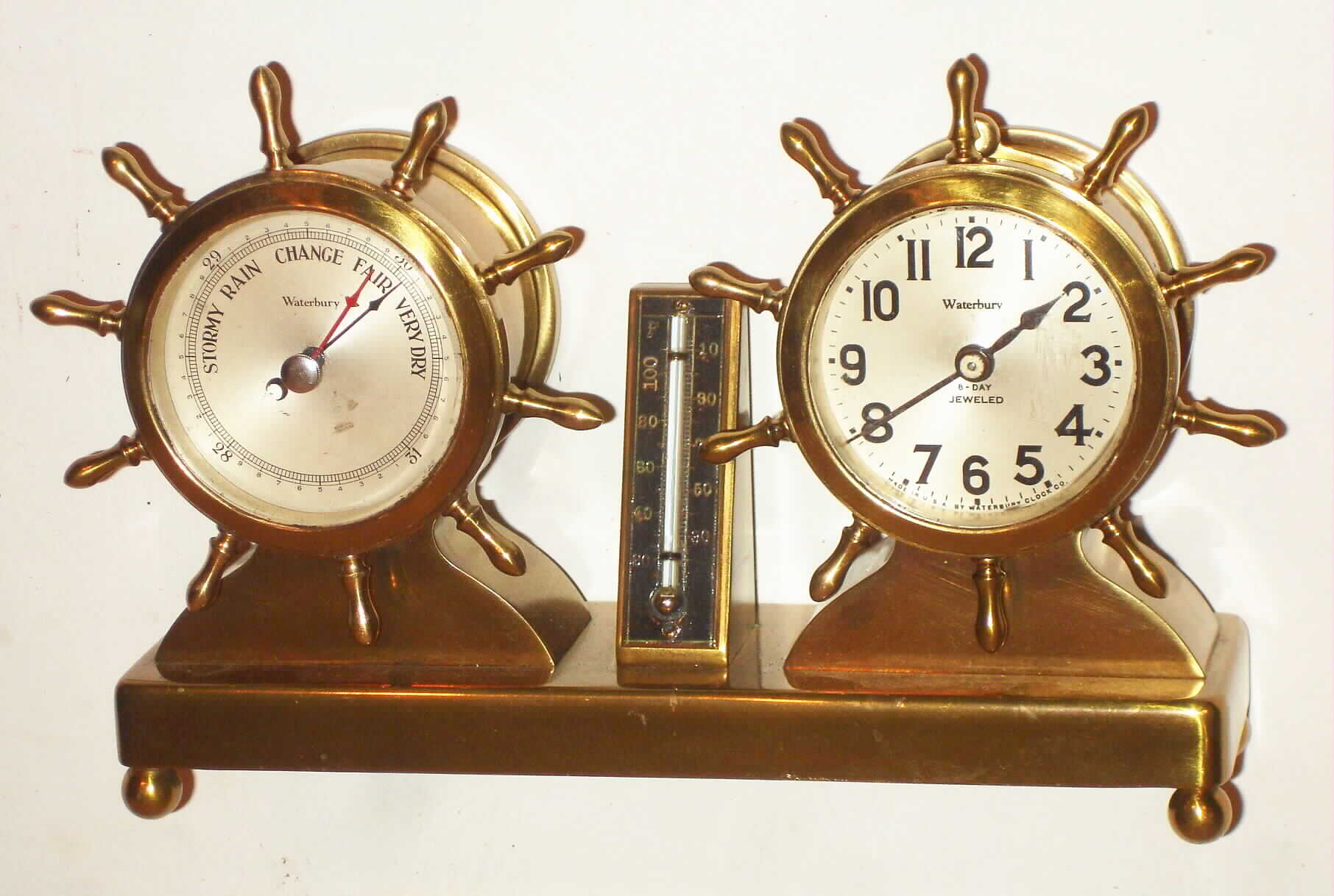 Waterbury Clock Co., Waterbury, Conn., "Commodore" brass, 8 day, time piece and barometer set, c1929 — Antique Clocks Price Guide