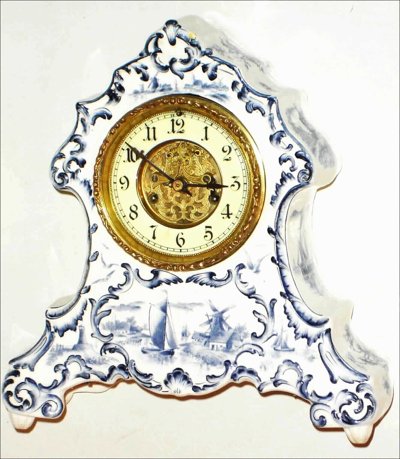 Waterbury Clock Co., Waterbury, Conn., Delft style, 8 day, time and strike porcelain mantel clock, c1900 — Antique Clocks Price Guide
