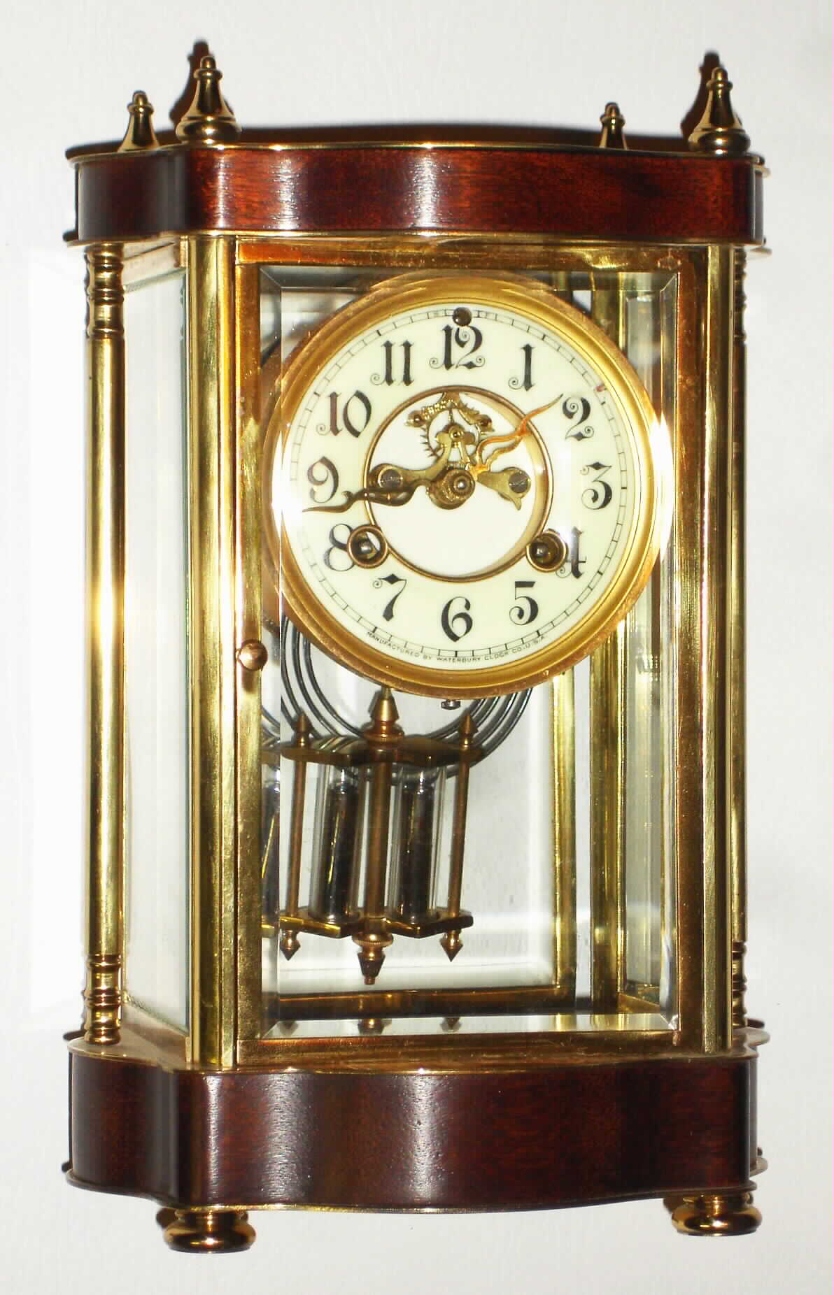 Waterbury Clock Co., Waterbury, Conn., "Brittany" gold plated and mahogany 8 day, time and strike crystal regulator, c1912 — Antique Clocks Price Guide