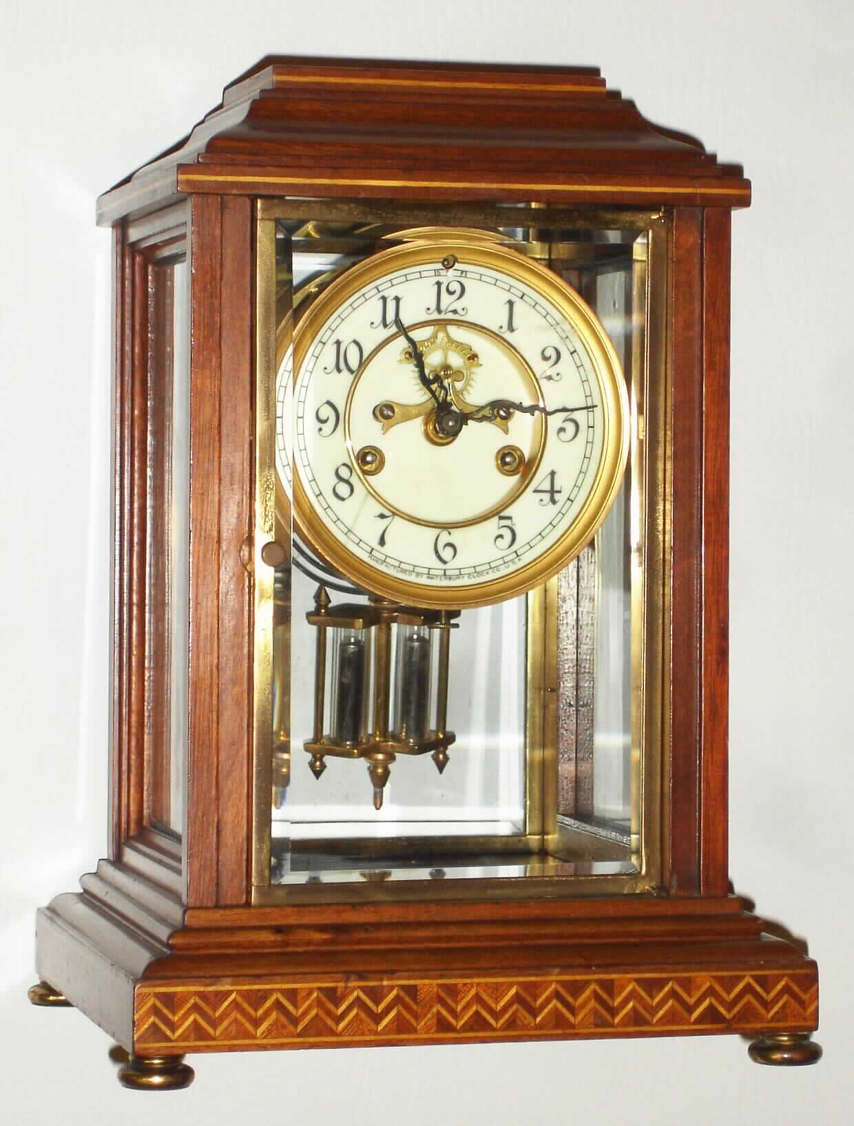 Waterbury Clock Co., Waterbury, Conn., "Cher" inlaid mahogany 8 day, time and strike crystal regulator, c1913 — Antique Clocks Price Guide