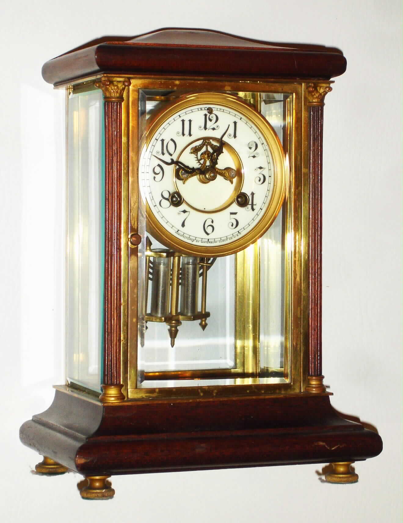 Waterbury Clock Co., Waterbury, Conn., "Vendee" mahogany and gold plated 8 day, time and strike crystal regulator, c1908 — Antique Clocks Price Guide