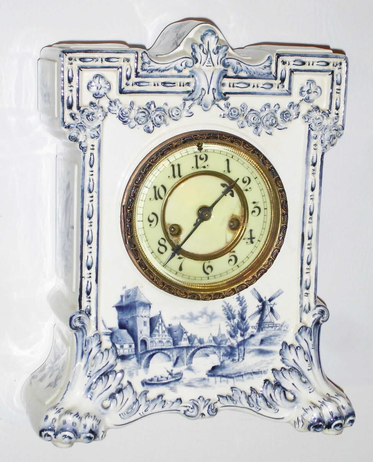 Waterbury Clock Co., Waterbury, Conn., "Parlor No. 42" 8 day, time and strike Delft style porcelain mantel clock, c1900 — Antique Clocks Price Guide
