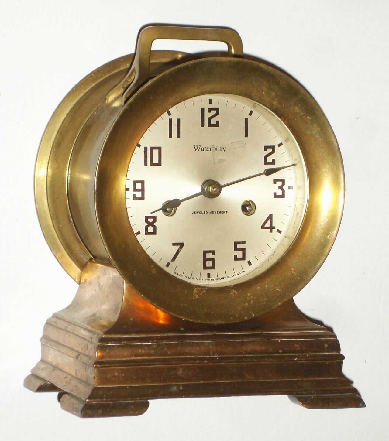 Waterbury Clock Co., Waterbury, Conn., "Ship's Bell No 1/2" 8 day, time and strike brass marine clock, c1917 — Antique Clocks Price Guide