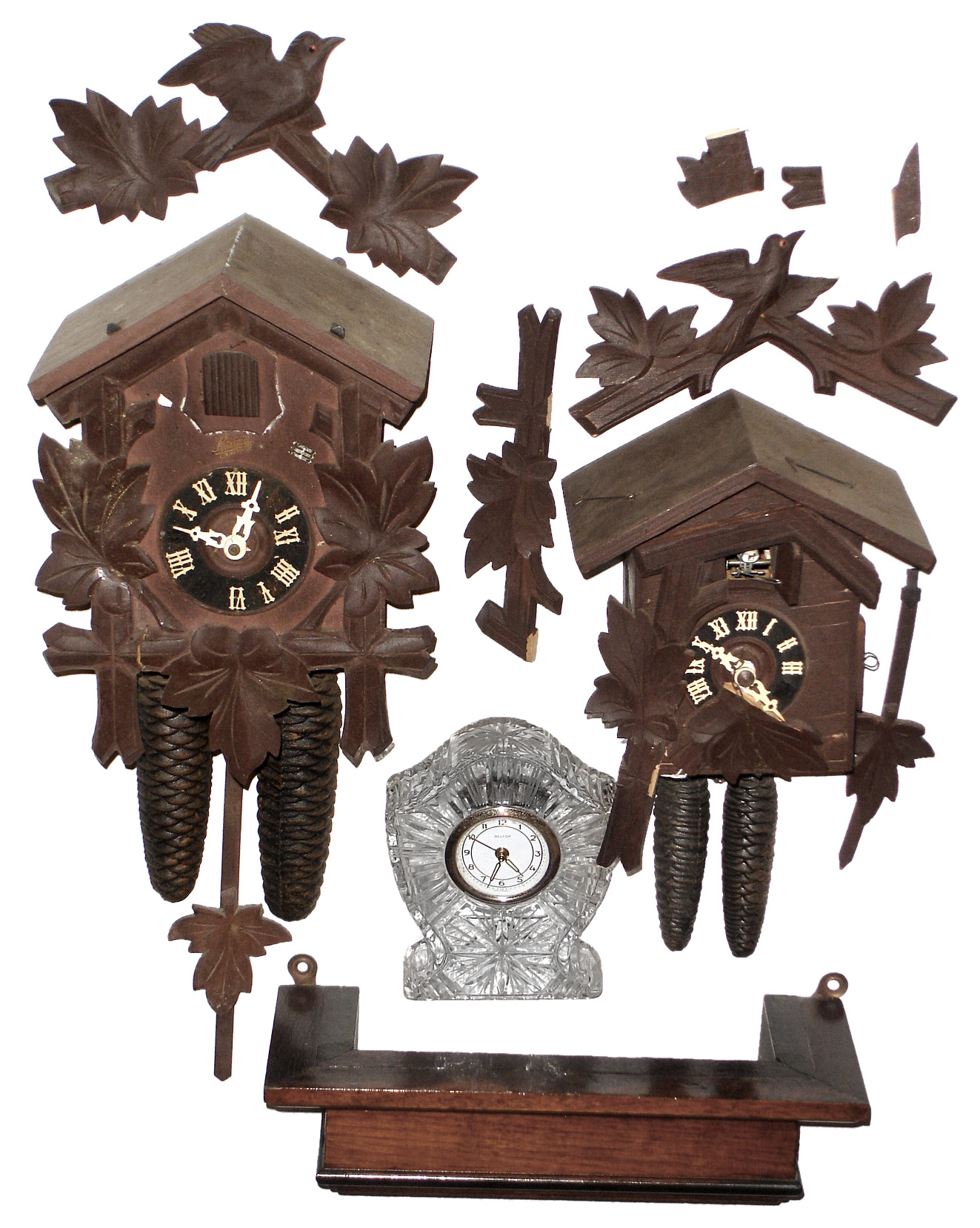Clocks- 3 (Three) German 30 hour modern clocks: two small cuckoos; Belfor pressed glass alarm clock. Wood clock shelf also included. — Antique Clocks Price Guide